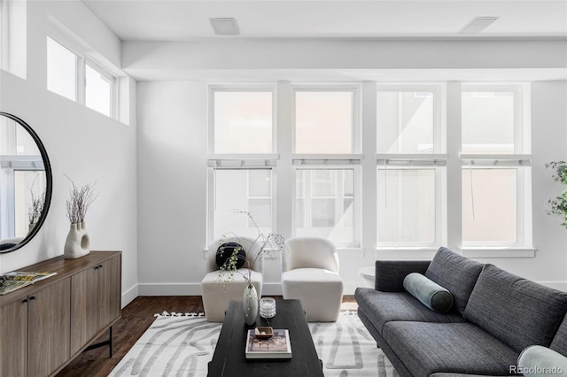1715 Boulder St, Denver, CO 80211 - living area featuring dark wood-style flooring and baseboards