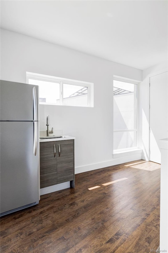 1715 Boulder St, Denver, CO 80211 - unfurnished living room featuring healthy amount of natural light and dark wood-style floors