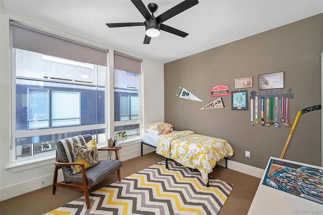 carpeted bedroom with ceiling fan