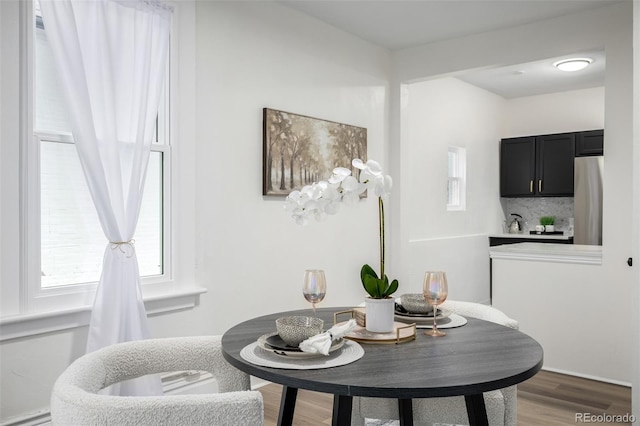 1019 26th St, Denver, CO 80205 - dining space featuring light wood finished floors and plenty of natural light