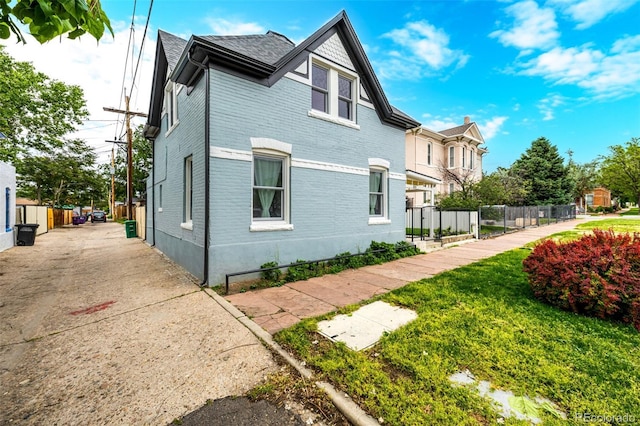 1019 26th St, Denver, CO 80205 - view of home's exterior featuring brick siding
