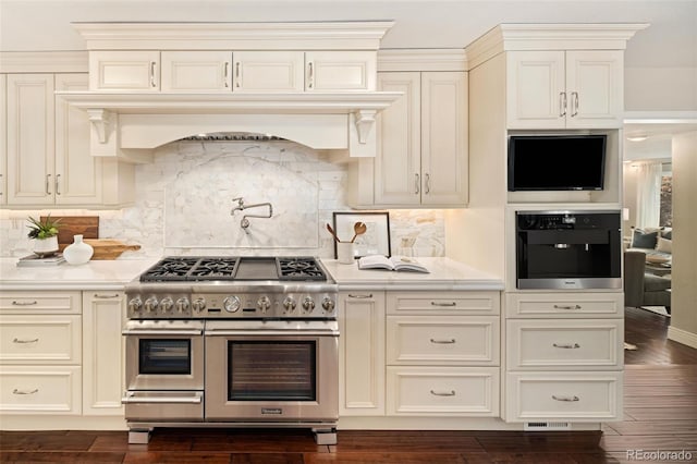 kitchen with premium range hood, backsplash, dark hardwood / wood-style flooring, double oven range, and wall oven