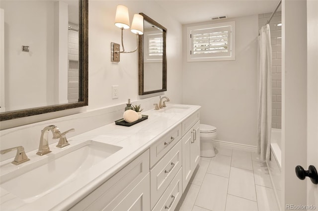 full bathroom with tile patterned flooring, vanity, shower / bath combo, and toilet