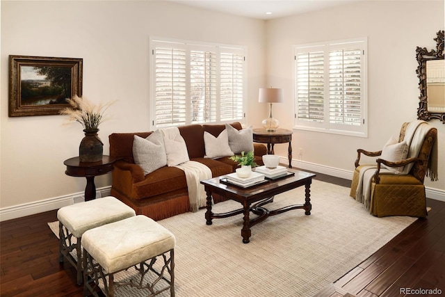 living room with a healthy amount of sunlight and dark hardwood / wood-style floors