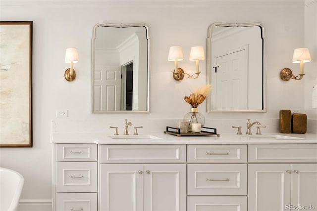 bathroom featuring vanity, a washtub, and crown molding