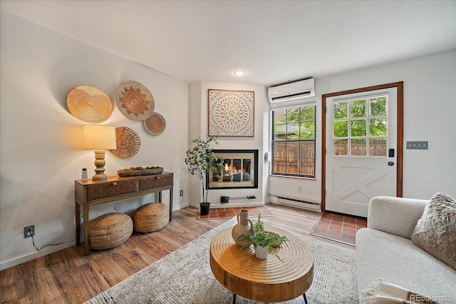 2429 Spruce St Unit 4, Boulder, CO 80302 - living room with a wall mounted air conditioner, a baseboard radiator, a glass covered fireplace, and wood finished floors
