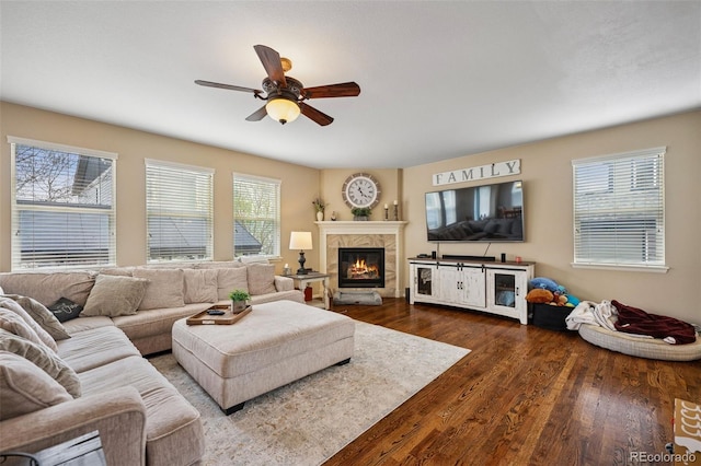 20366 Spruce Point Pl, Parker, CO 80134 - living area featuring a ceiling fan, a glass covered fireplace, and wood finished floors