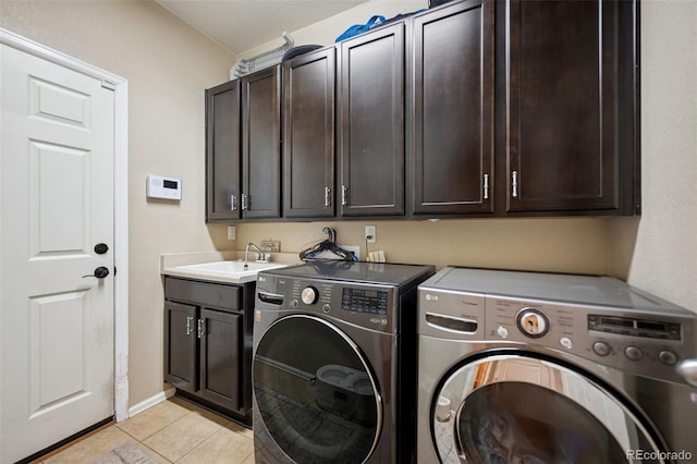 20366 Spruce Point Pl, Parker, CO 80134 - washroom with cabinet space, washer and dryer, and light tile patterned flooring