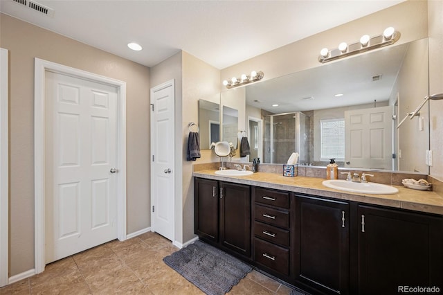 20366 Spruce Point Pl, Parker, CO 80134 - bathroom featuring double vanity, a shower stall, and tile patterned floors