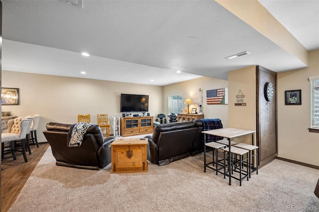 20366 Spruce Point Pl, Parker, CO 80134 - living area featuring a textured ceiling, recessed lighting, and light carpet