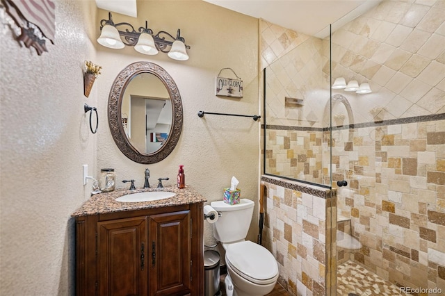 20366 Spruce Point Pl, Parker, CO 80134 - full bath featuring tiled shower, a textured wall, and vanity