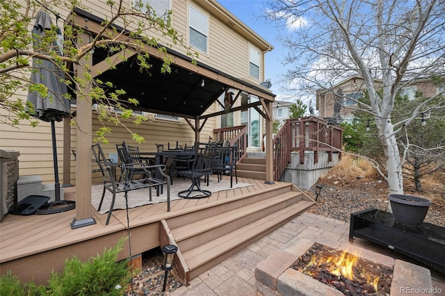 20366 Spruce Point Pl, Parker, CO 80134 - deck with a gazebo, a fire pit, outdoor dining area, and stairs