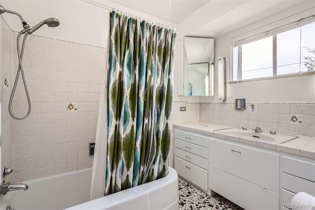 full bath with vanity, shower / tub combo with curtain, and tasteful backsplash