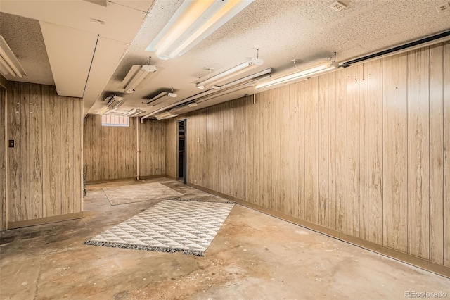 below grade area featuring wooden walls