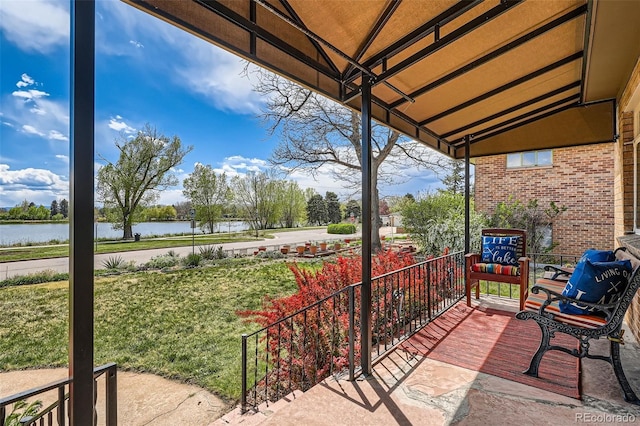 view of patio / terrace with a water view