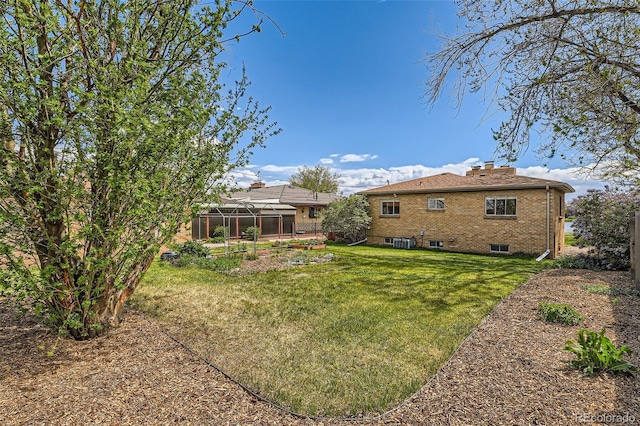 view of yard featuring a lanai