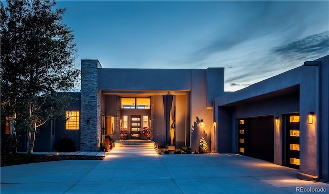 contemporary home with stucco siding