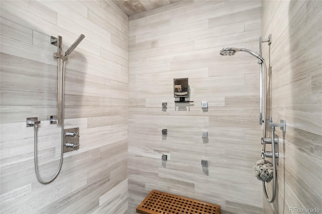 bathroom with tiled shower