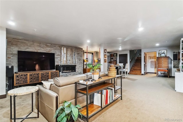 carpeted living area with stairway, recessed lighting, a fireplace, and baseboards