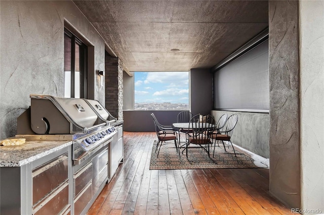 view of patio / terrace featuring an outdoor kitchen and outdoor dining area