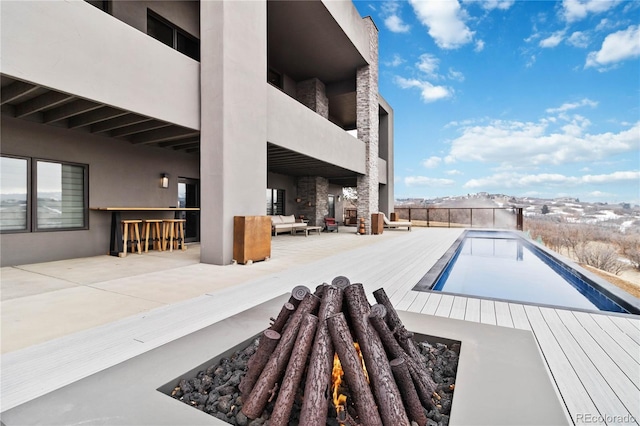 pool featuring an outdoor living space and a patio