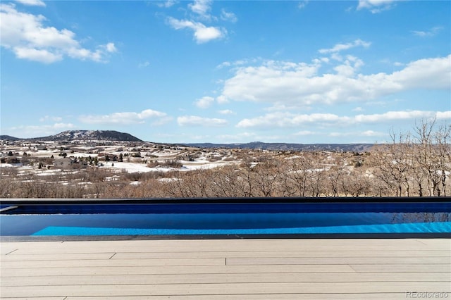 view of pool with a mountain view