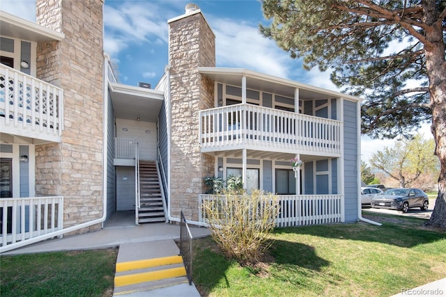 8335 Fairmount Dr Unit 7-208, Denver, CO 80247 - view of building exterior featuring stairs