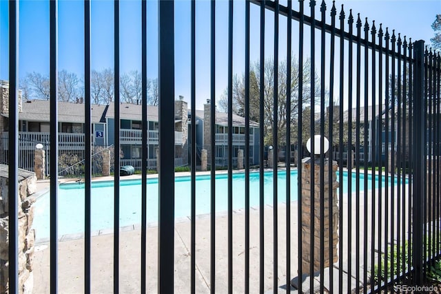 8335 Fairmount Dr Unit 7-208, Denver, CO 80247 - gate with a community pool