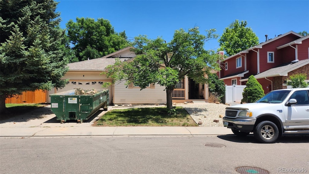 756 Brookside Dr, Longmont, CO 80504 - obstructed view of property with an attached garage