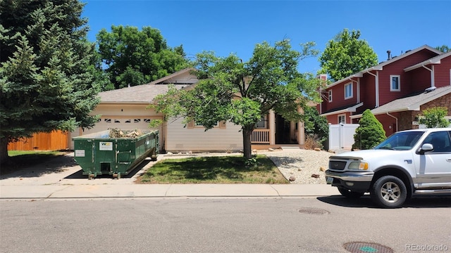 756 Brookside Dr, Longmont, CO 80504 - obstructed view of property with an attached garage