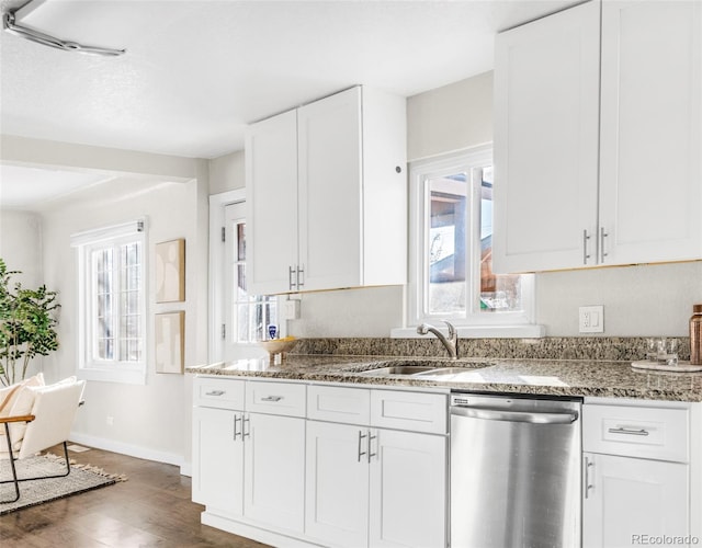 kitchen with dishwasher, sink, a wealth of natural light, and white cabinets