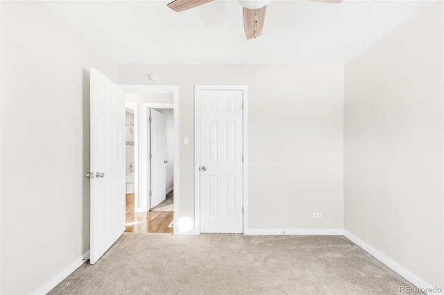 unfurnished bedroom with light colored carpet and ceiling fan