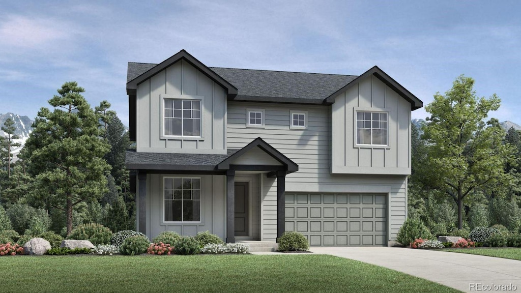 view of front of house with a garage and a front yard