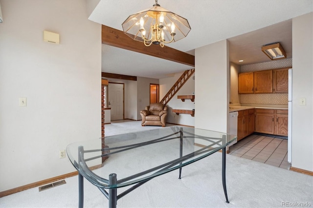 dining area featuring light colored carpet, stairway, a chandelier, and baseboards