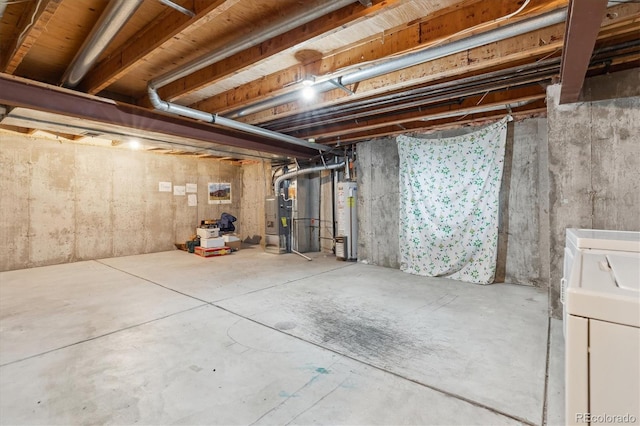 unfinished basement featuring water heater, washer / clothes dryer, and heating unit