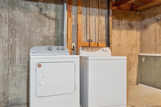 laundry room featuring washing machine and clothes dryer