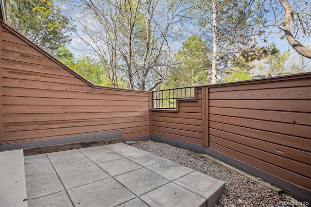 view of patio featuring fence