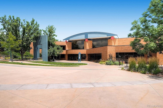 view of property featuring concrete driveway