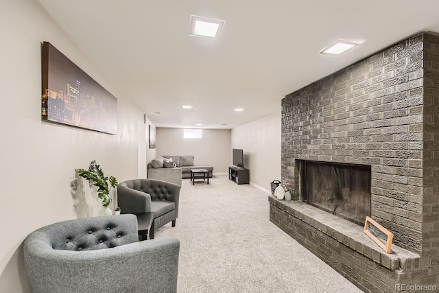 living room with carpet floors, a fireplace, and baseboards