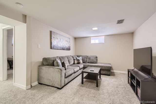 living room with carpet floors, visible vents, and baseboards