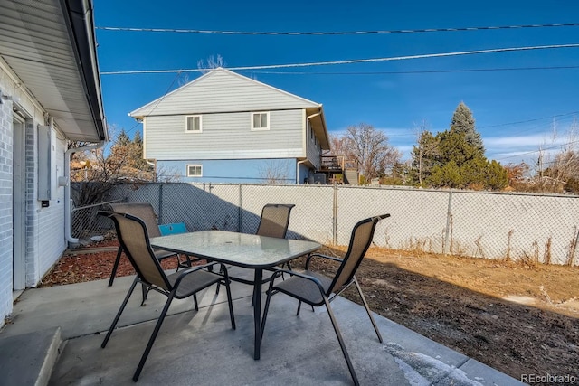 view of patio / terrace with outdoor dining area and a fenced backyard