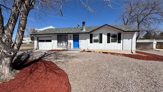 ranch-style house featuring brick siding, board and batten siding, an attached garage, and a shingled roof