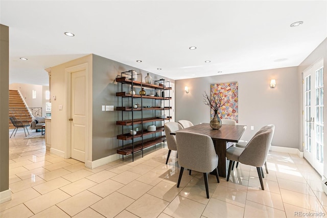 dining space featuring light tile patterned flooring