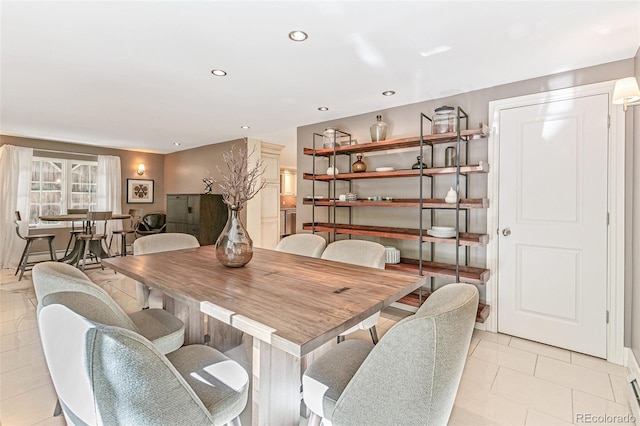 dining space featuring light tile patterned flooring