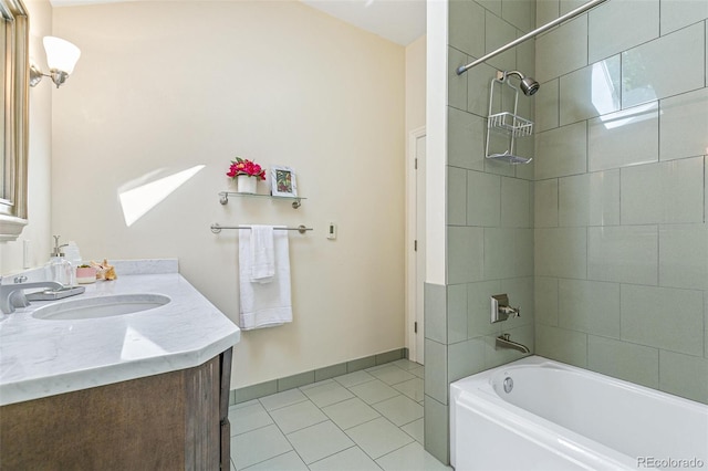 bathroom featuring vanity, tiled shower / bath combo, and tile patterned floors