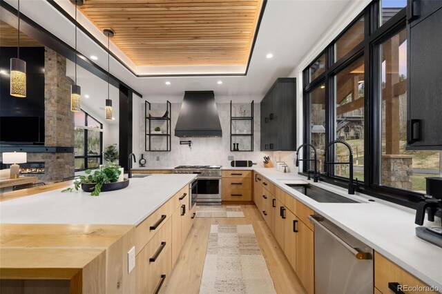 2800 Honors Ct, Silverthorne, CO 80498 - kitchen featuring premium range hood, stainless steel appliances, wooden ceiling, a sink, and light brown cabinets
