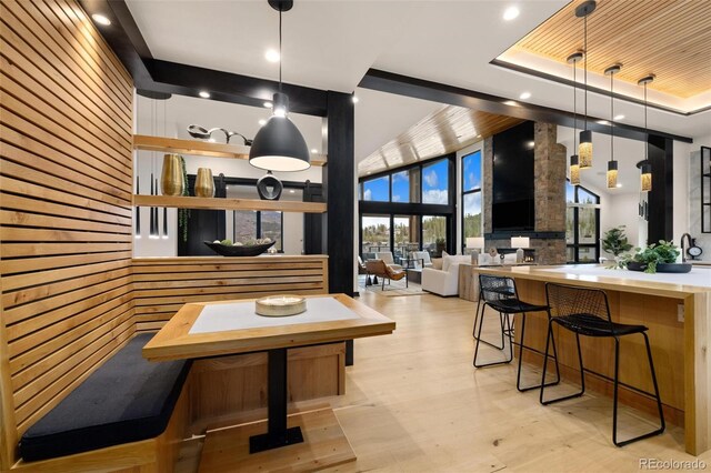 2800 Honors Ct, Silverthorne, CO 80498 - dining room featuring healthy amount of natural light, recessed lighting, a raised ceiling, light wood finished floors, and a high ceiling