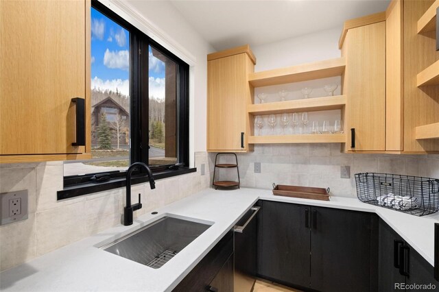 2800 Honors Ct, Silverthorne, CO 80498 - kitchen featuring open shelves, a sink, light countertops, and backsplash