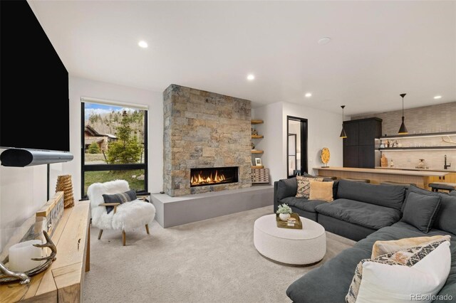 2800 Honors Ct, Silverthorne, CO 80498 - carpeted living area with recessed lighting and a stone fireplace