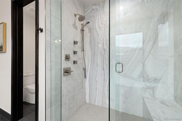2800 Honors Ct, Silverthorne, CO 80498 - full bathroom featuring a marble finish shower and toilet